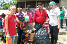 Students distribute gifts to the villagers of La Caada