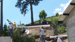 carrying pipes to connect the well to the water tanks