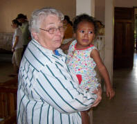 Sr. Juanita holds child in the Sulaco Malnutrition Center
