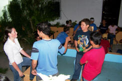 Amanda Cronin visits with the teens of Esquias in the compound