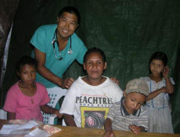 Dr. David Goo poses with some patients