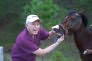 Dr. Bjorge checking horse's teeth