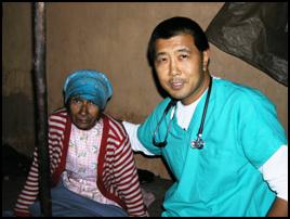 Dr. David Goo poses with a patient in Monterey.
