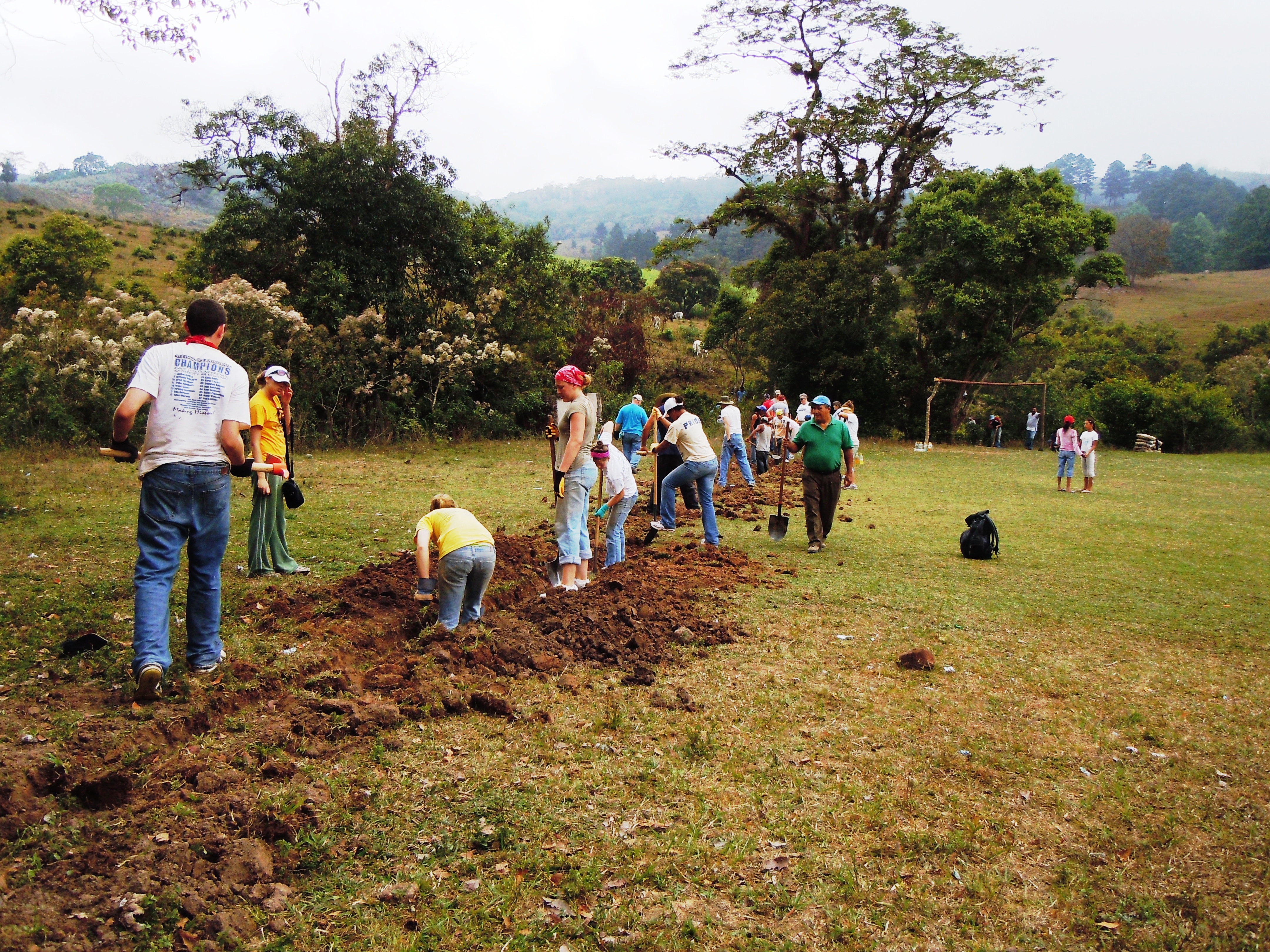 Group digs trenches for water pipes