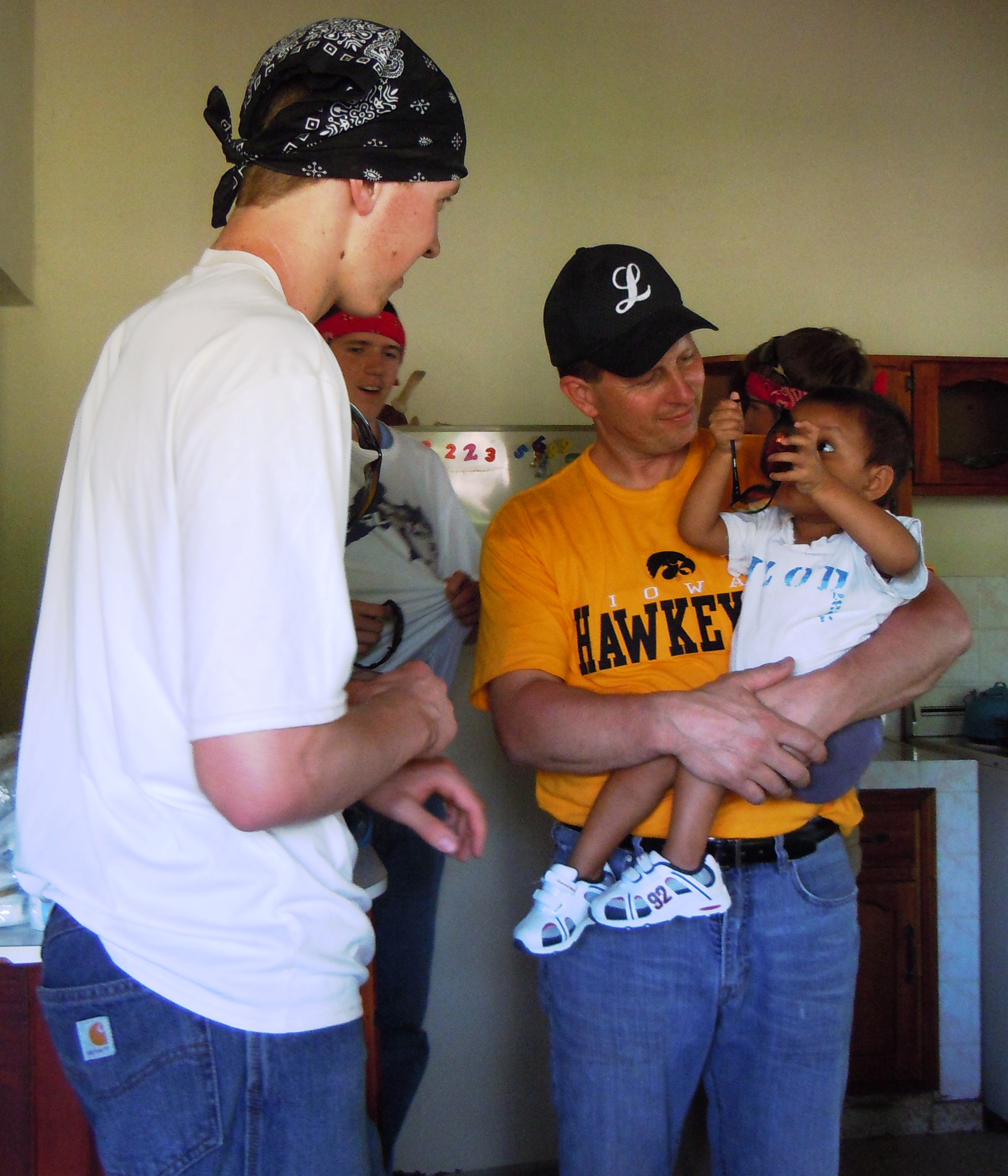 Missioners hold children from the Malnutrition Center in Sulaco