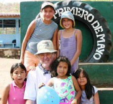 Francis Seivert poses with a group of orphans