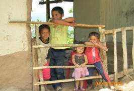 young children watch water project progress