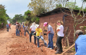 team digs trenches for water pipes