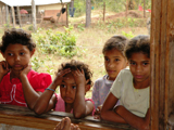 Children watch the medical team prepare for patients