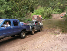 Driving through the river to get to Montana de la Flor